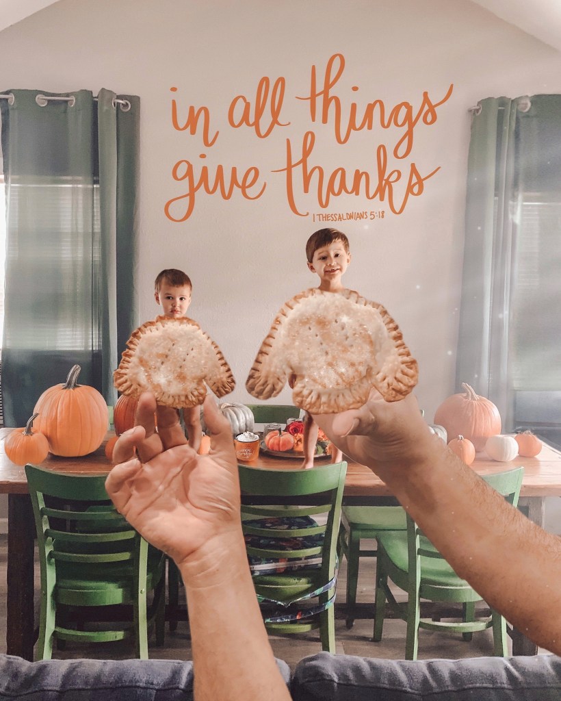 Two boys standing on table for Autumn creative photo shoot with Sweater shaped hand pies